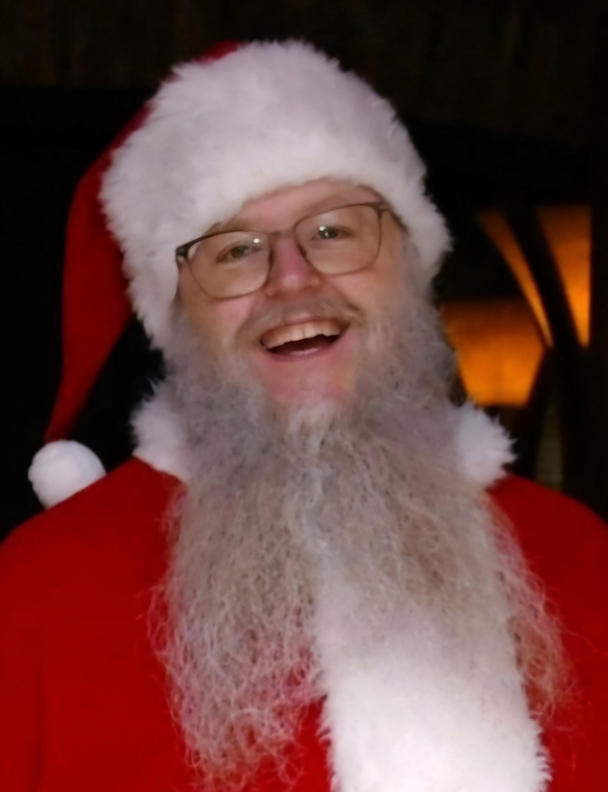 Santa smiling in classic red suit and hat